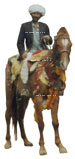 Inder mit einem weißen Turban auf einem geschmückten Pferd.